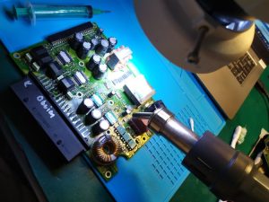 car amplifier opened showing circuit board