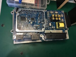 car amplifier opened showing circuit board